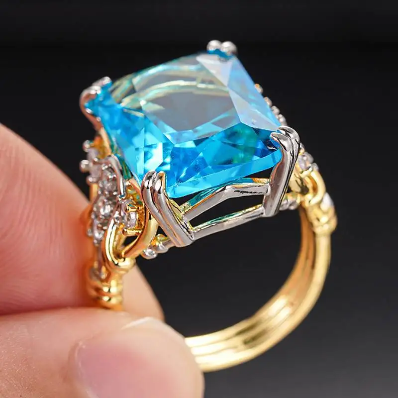 Huitan Zarter zweifarbiger Damenring, elegante Hochzeit, edle Party-Accessoires, trendiger Schmuck mit eingelegtem, glänzendem blauen Zirkonia
