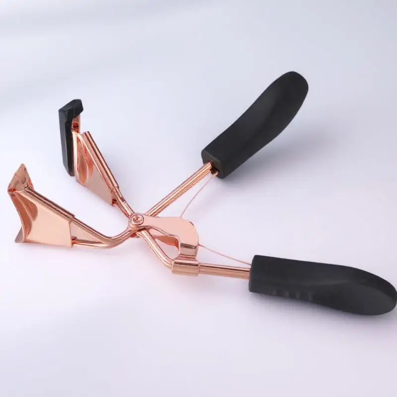 

Stylish Rose Gold Eyelash Curler Professional Grade Beauty Tool with Replaceable Pads and Strong Spring Compact for on The Go