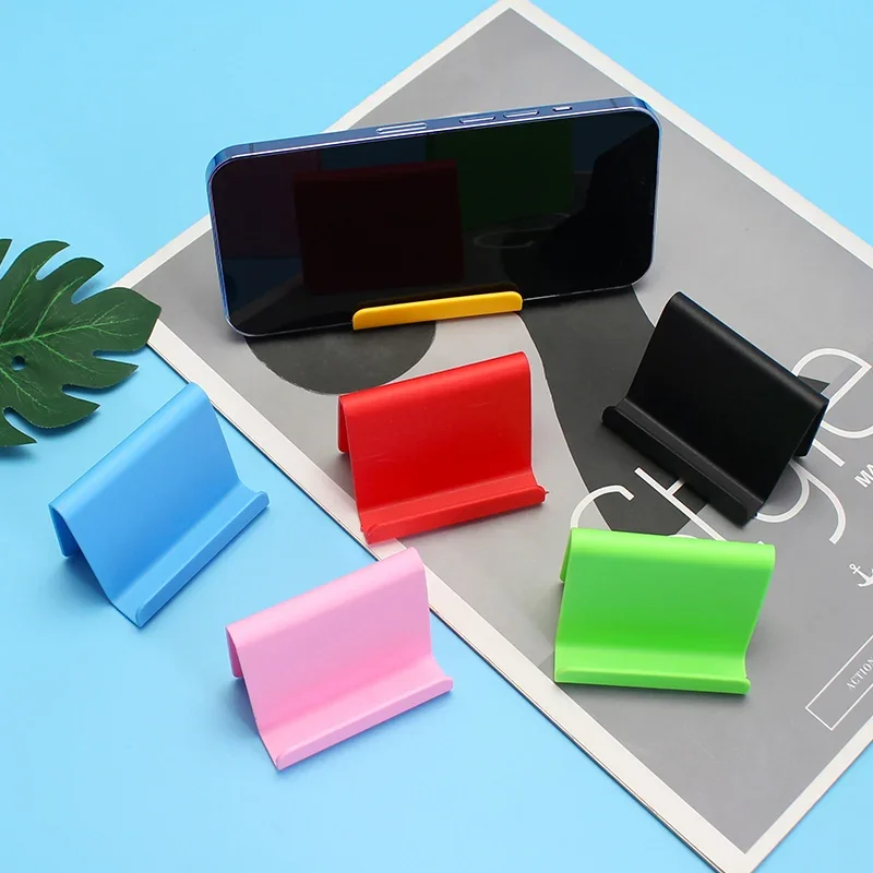 Soporte de escritorio de plástico para teléfono móvil, Mini soporte portátil Universal para teléfono inteligente, Color caramelo