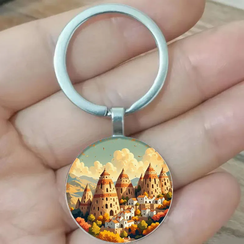 

Circular with colorful autumn trees and snow mountain keychains as holiday gifts