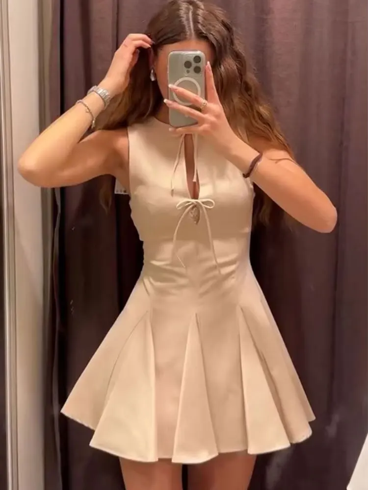 Abito elegante da donna solido O-Collo senza maniche Mini abiti slim 2025 Abito da sera da donna con lacci e orlo largo ondulato estivo
