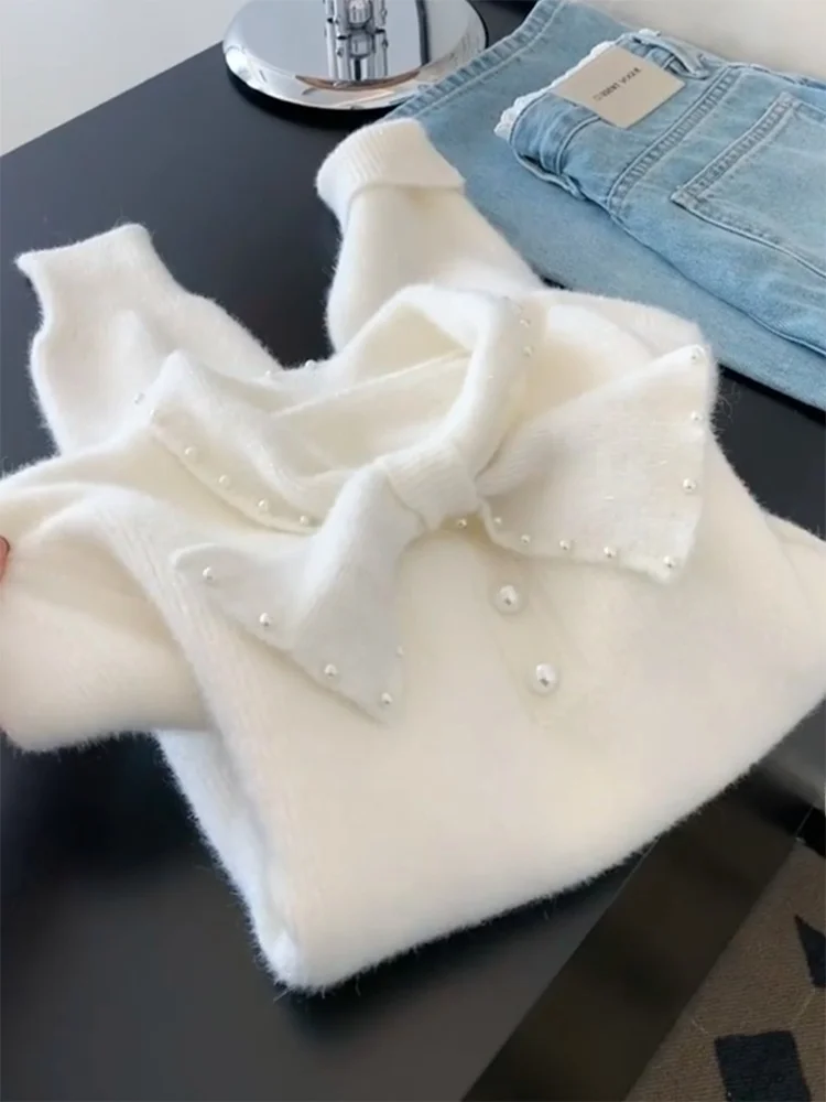 

Весна 2026: Модный свитер большого размера с узлом на горловине, нежный и универсальный топ для молодых женщин