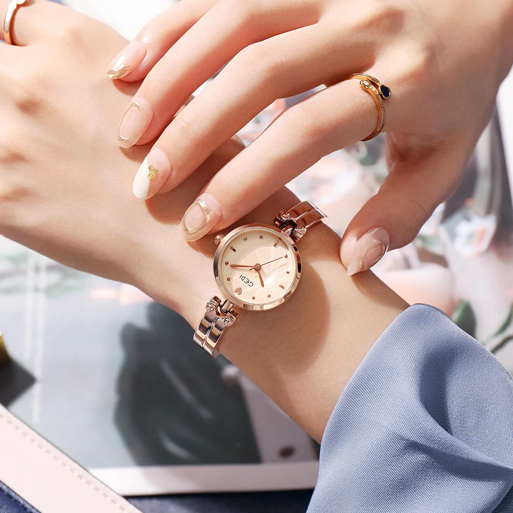 Small round women's watch with steel strapsimple and casual, petite student wristwatch, women's quartz watch, women's accessory.