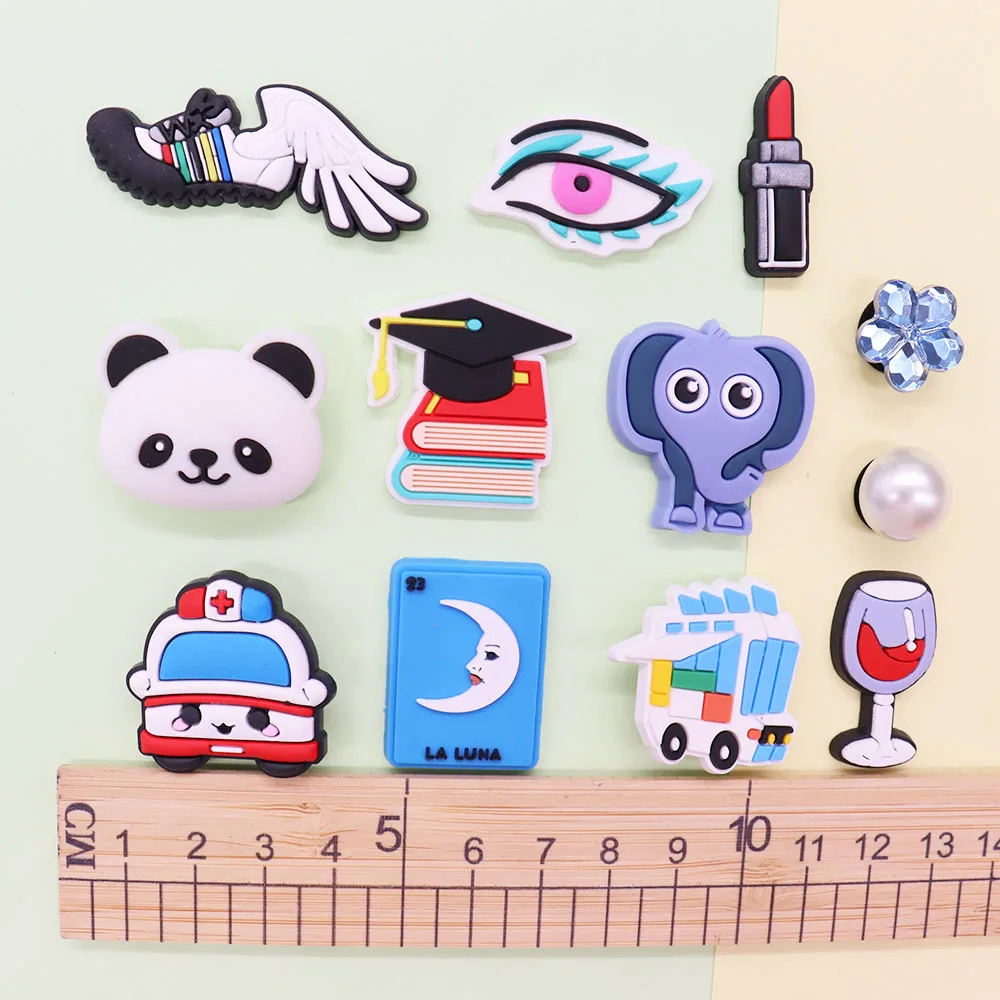 Mix 50PCS PVC Shoe Charms Panda Eye Red Wine Moon Lipstick Ambulance Book Elephant Hole Shoes Ornaments Button Decorations