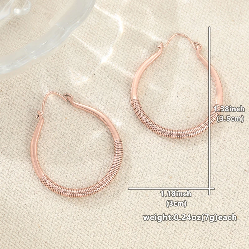 Vintage-Ohrringe in Bronzefarbe für Damen, geometrisches, handgeschnitztes Wickelmuster, für Partys und den Alltag – Detail 4