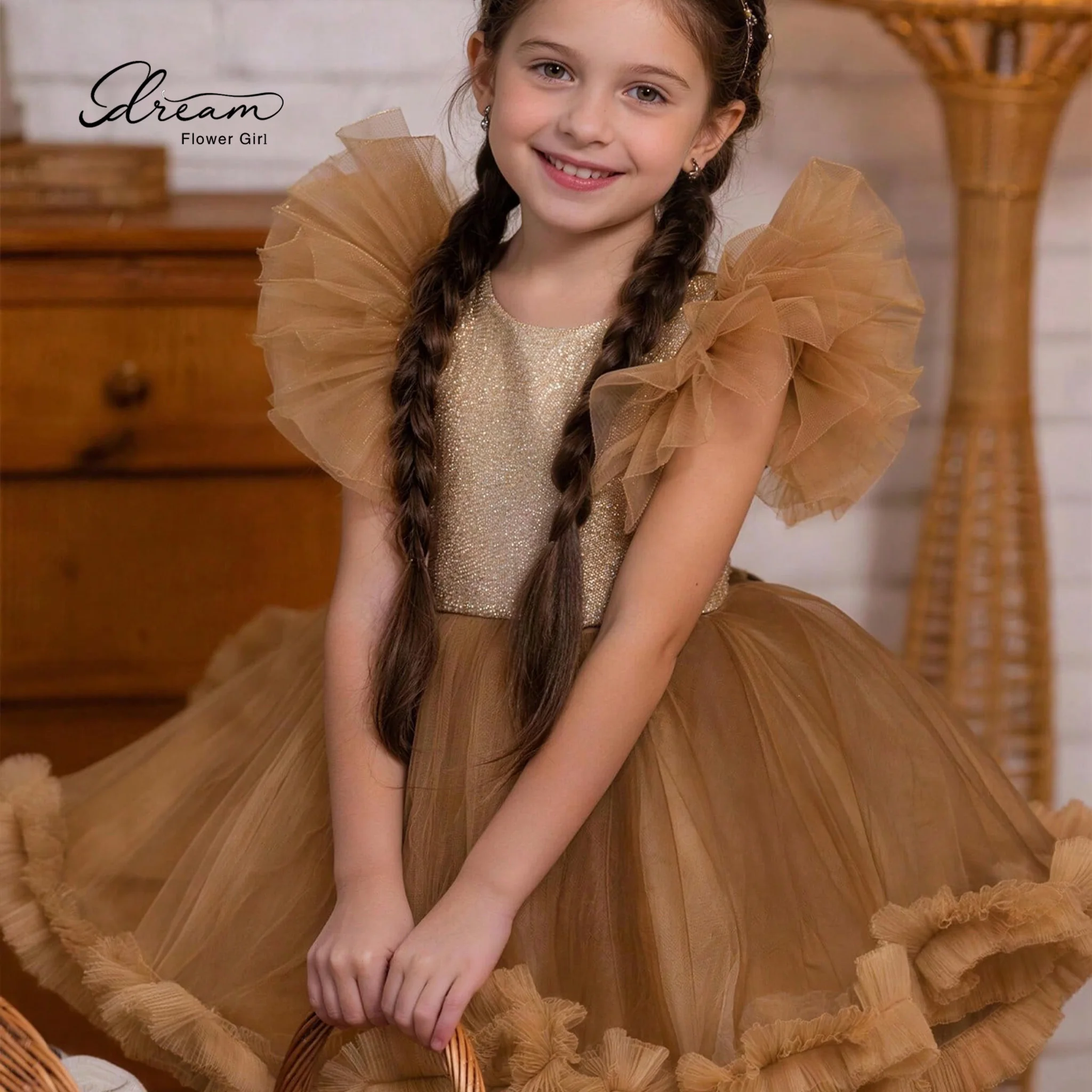 Champagne-colored formal party dress for girls featuring a round neck bell sleeves a voluminous skirt and a lace-up back