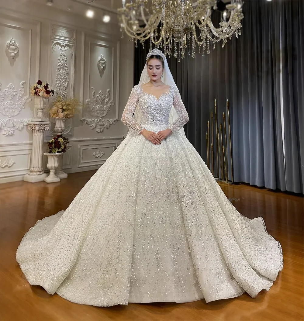 Customized Luxury Sparkly Beaded Wedding Dress Sweetheart Neck Long Sleeves Lace Ball Gown Bridal Dress Amanda Novias Official