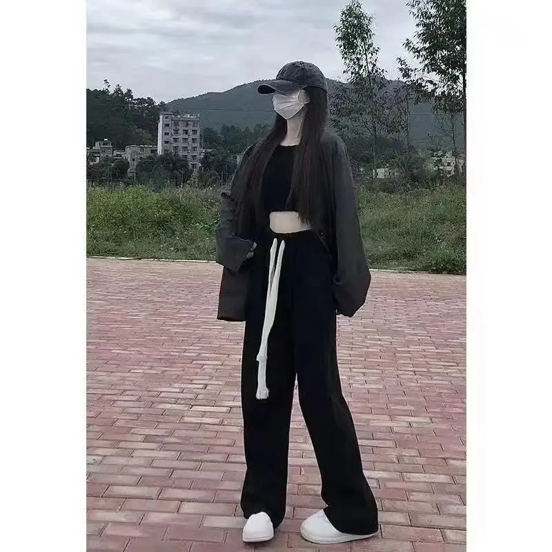 بنطال ذو قصة أرجل واسعة للنساء صيفي رفيع للغاية مثقوب مفرغ واسع الأرجل مقسم محب ناعم مطابق للتهوية قابل للتمدد 2025