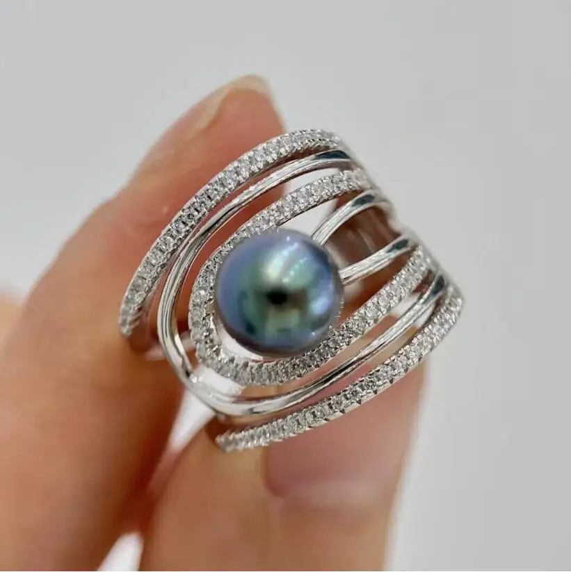 

Потрясающее кольцо с таитянским круглым черным зеленым жемчугом диаметром 10–11 мм, 925-х годов.