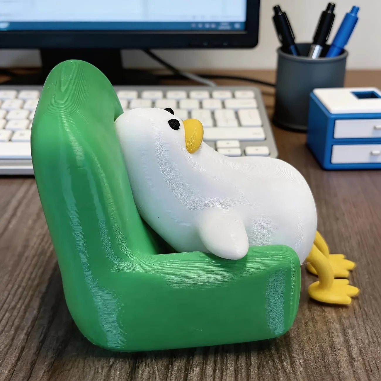 A lying duck with a funny and cute expression, a small office desk decoration, creative animal shape. view 2