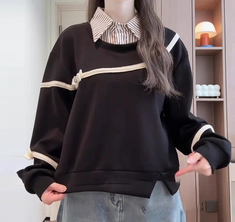 เสื้อสเวตเตอร์ผู้หญิงไซส์ใหญ่ สไตล์หวาน แต่งโบว์ ดูเหมือนสองชิ้น แฟชั่นอเนกประสงค์ ทรงหลวม แขนยาว ช่วยลดอายุ สีดำ เหมาะสำหรับฤดูใบไม้ร่วงและฤดูหนาว