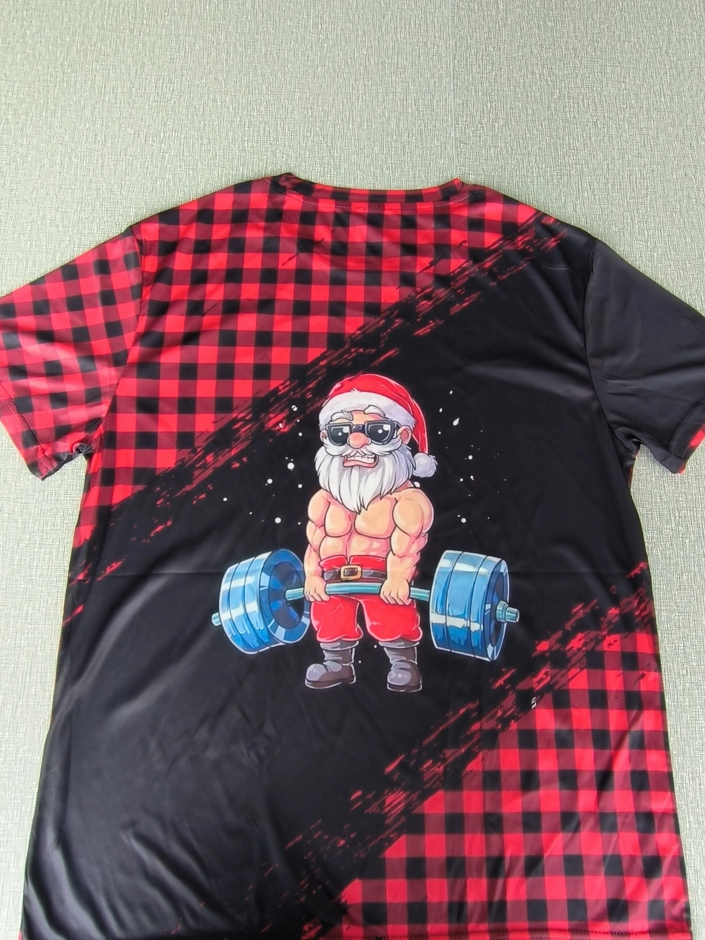 Men Red Black Buffalo Plaid Diagonal Brush Stroke Muscular Santa Lifting Barbell Print Crew Neck Short Sleeve T-shirt