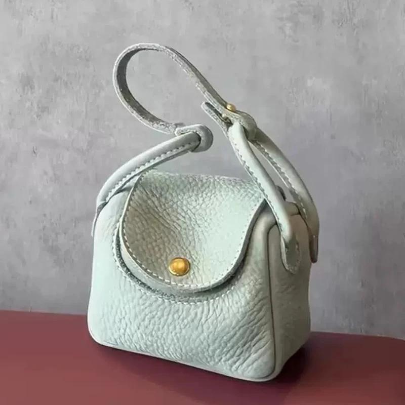 Moda Mini caja linda Bolsas para mujeres Bolsos y monederos de diseñador de lujo 2026 Nuevo en PU Grano manija superior Botón decoración cadena Bolso de hombro alta calidad envío gratis Llega el envío rápido