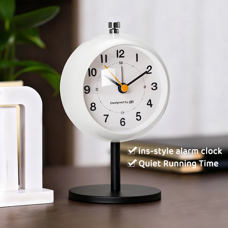 Minimalist-style, stylish, silent bedroom table clock with a metal casing; operates on 1 AA battery