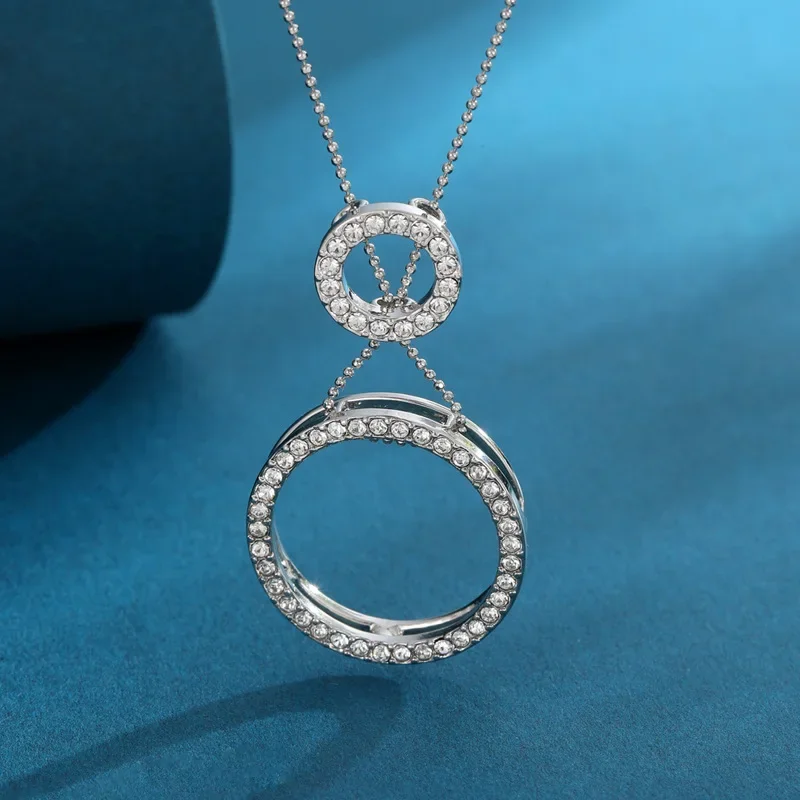 多機能でファッショナブルな幾何学的なサークルが女性のための調節可能なネックレスを取り出す