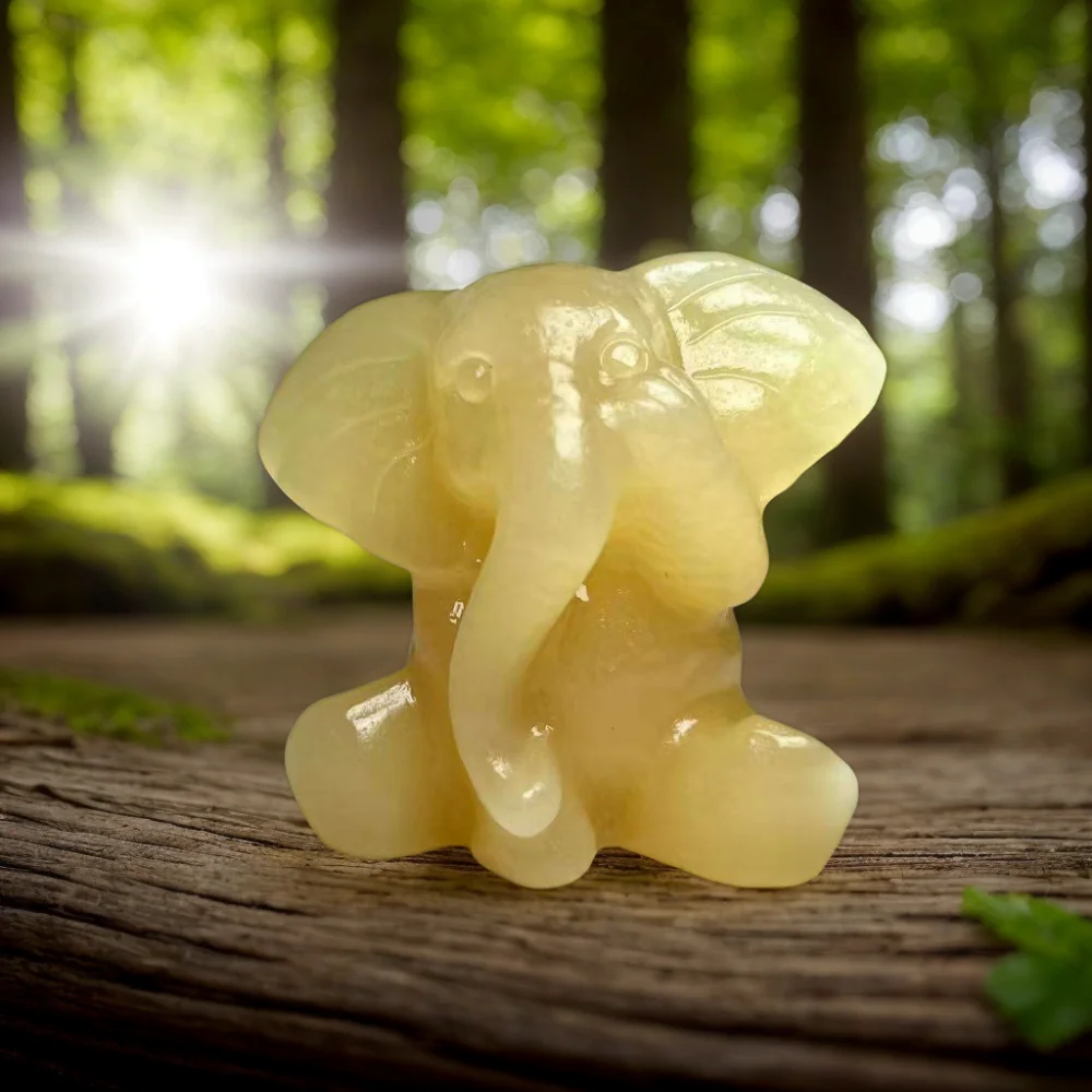 A honey-yellow calcite elephant—measuring approximately 5 cm—makes for both an exquisite home decoration and an ideal gift