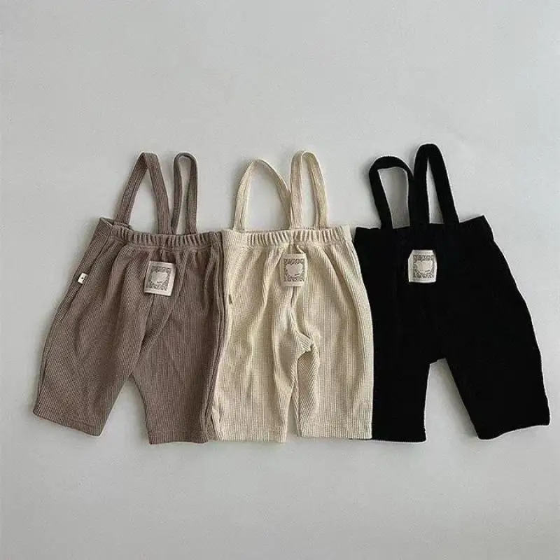 2024 New Infant Cotton Leggings Solid Baby Strap Pants Cute Toddler Waffler Stretch Pants Loose Baby Girl Casual Pants 0-24M