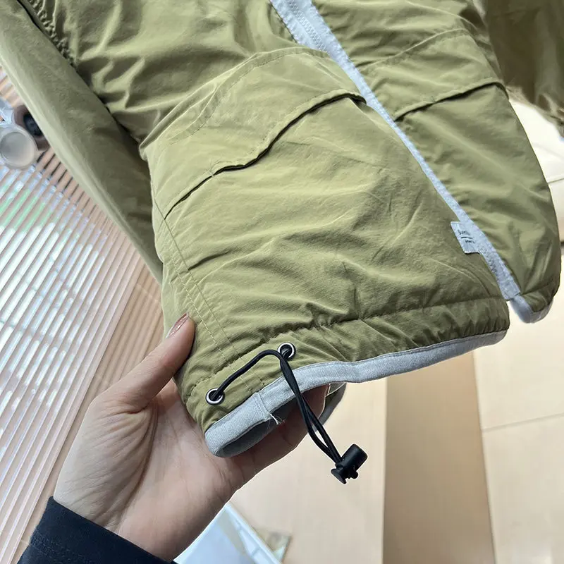 Für den Outdoor-Einsatz im Herbst und Winter ist dieser doppelseitige, warme, dicke, locker geschnittene Mantel mit Stehkragen sowohl für Männer als auch für Frauen geeignet. – Detail 15