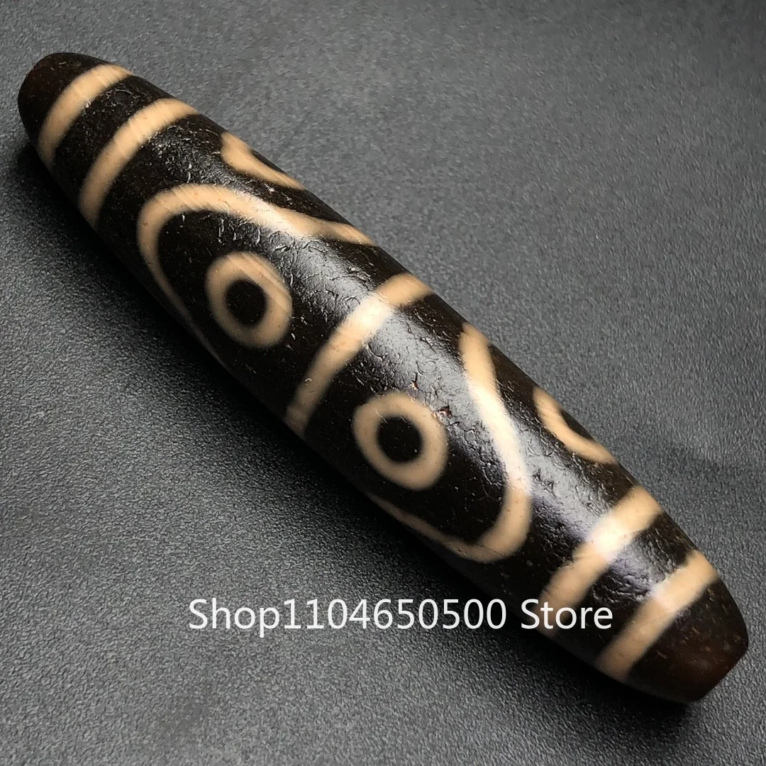 

Special clearance Tibetan area return old material high oil coating pulp [eight eyes dzi beads] Size: 59 * 12 mm