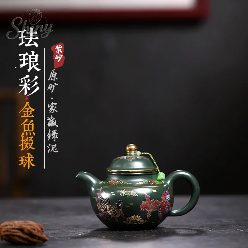 

Yixing Purple Clay Teapots Are Handcrafted From Raw Green Clay with Enamel-colored Gold Fish and Duoqiu