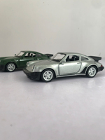 A 1:36 simulated Porsche 911 1978 alloy model car with openable doors, a children's gift car