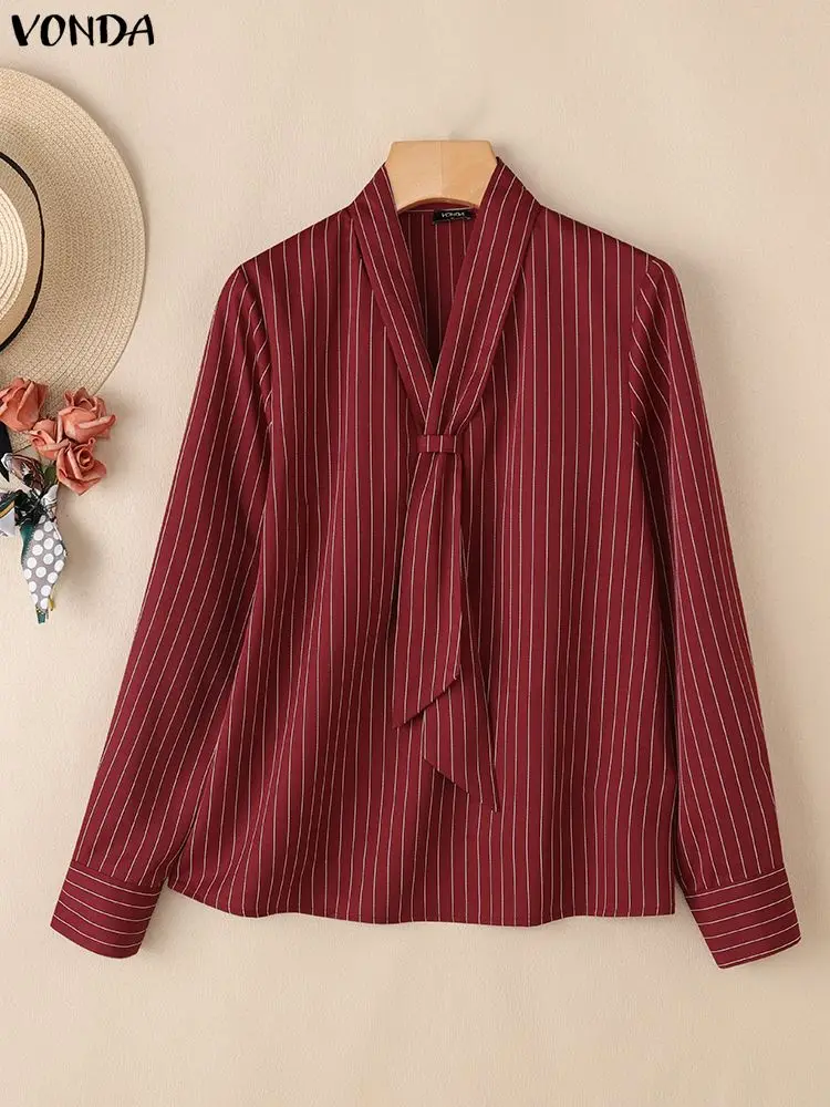 Elegancka bluzka damska VONDA do biura, dekolt w serek, koszule w paski, moda 2025, długi rękaw, luźny krój, nadruk, bluzki damskie do pracy.