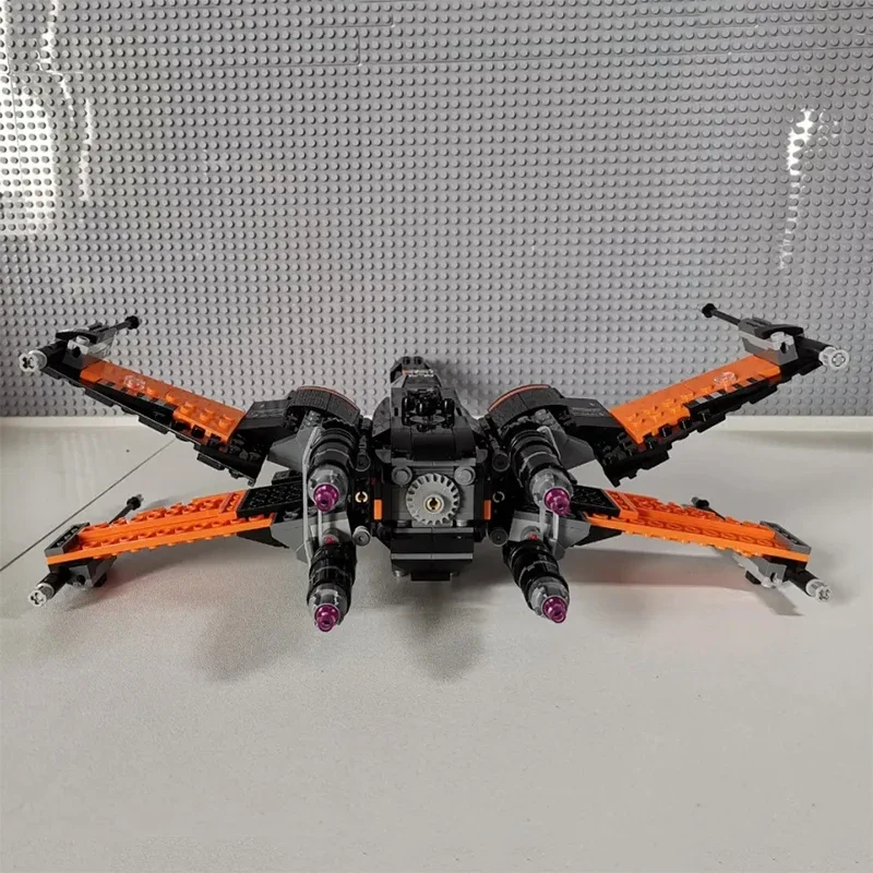 717 ชิ้น สินค้าใหม่ในสต็อก ชุดตัวต่อโมเดลยานอวกาศ X-wing Fighter ของโป สงครามอวกาศ ของเล่นตัวต่อประกอบเอง ของขวัญสำหรับเด็กผู้ชายและผู้ใหญ่