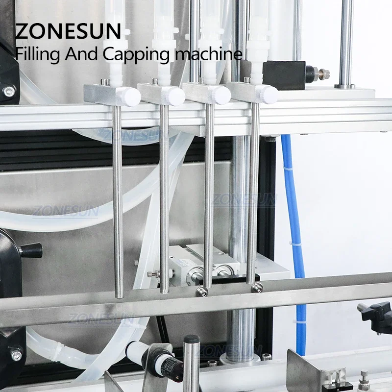 ZONESUN ماكينة تعبئة وتغطية العطور السائلة ذات 4 رؤوس أوتوماتيكية مع وحدة تغذية الغطاء لخط الإنتاج