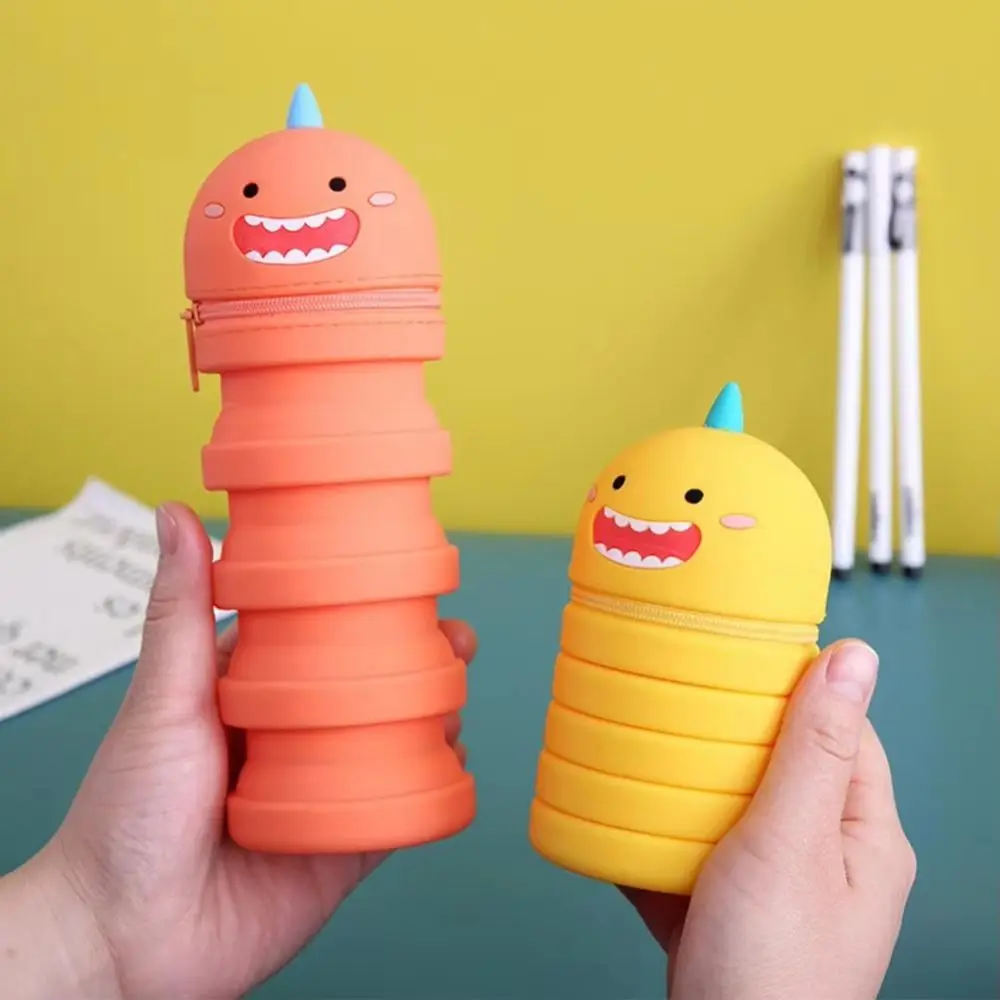 3D ไดโนเสาร์น้อยดินสอกันน้ําขนาดใหญ่ความจุซิลิโคนเครื่องเขียนกล่องการ์ตูน Kawaii เหรียญโรงเรียน