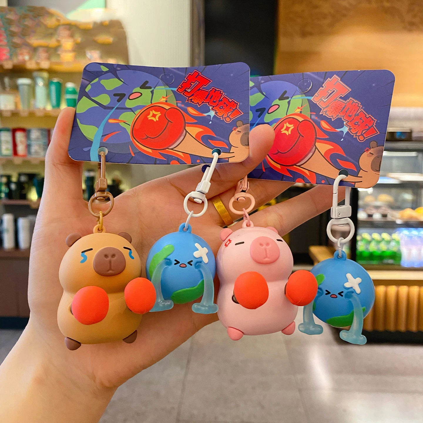 Cartoon Boxing Gloves Angry Brown Capibala Beating the Earth Doll Key Chain Pendant Pink Capybara Pig Earth Shed Tears Keychain