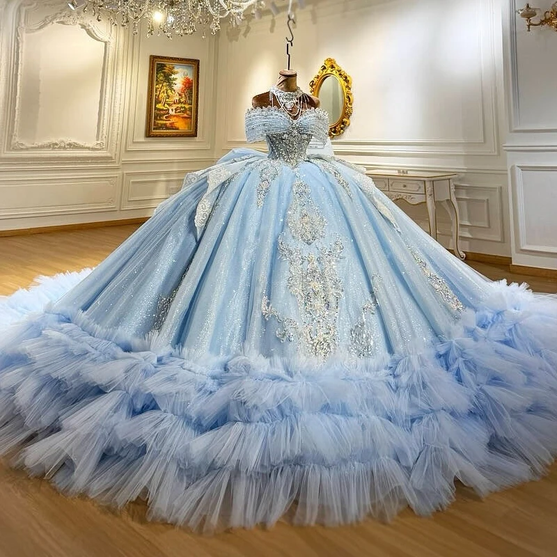 

Sky Blue Shiny Ball Gown Quinceanera Dresses Applique Lace Beading Crystal Bow Tiered Tull Corset Off The Shoulder Sweet 16