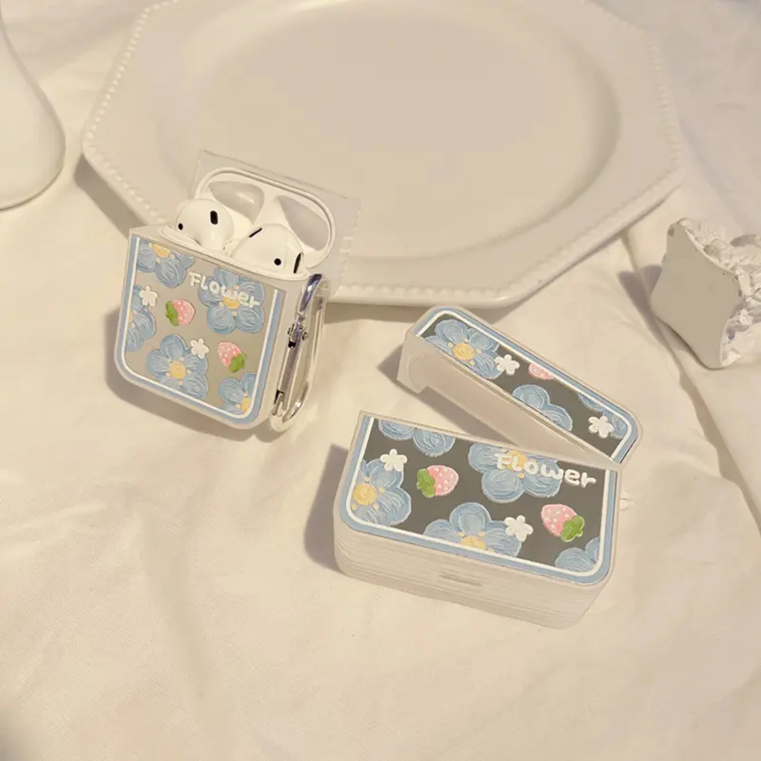 

e and chic accessory. Protect your AirPods in style with this exquisite and charming Flower Strawberry Protective Earphone Case.