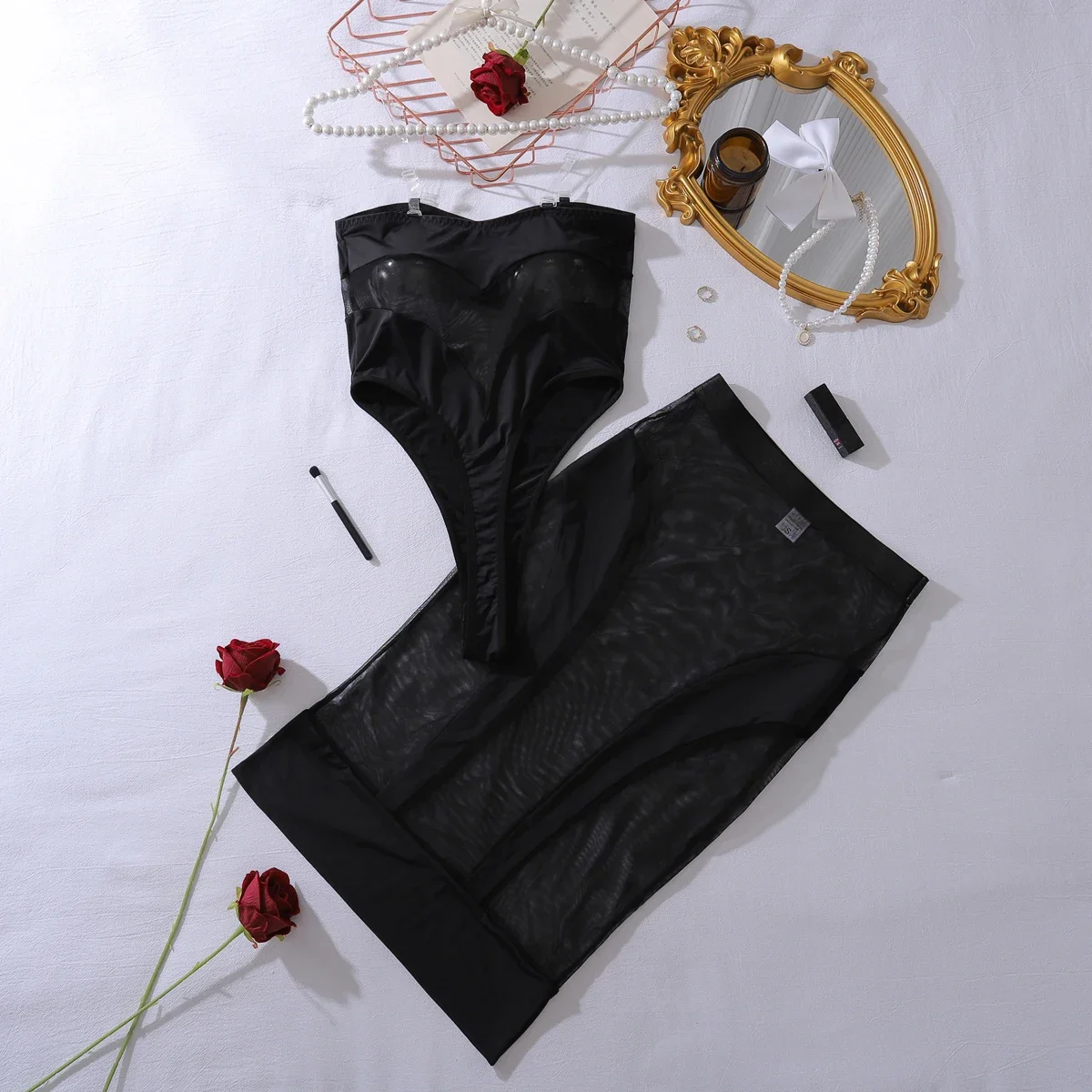 Conjunto de dos piezas de mono sexy de media falda de malla de retales ajustado con perspectiva europea y americana 2025