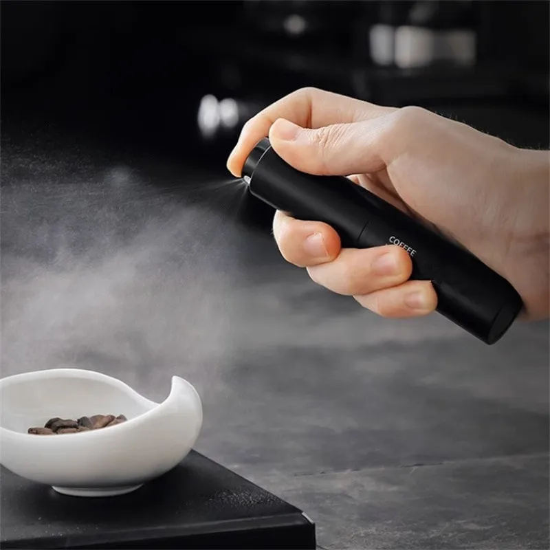 Tragbare 1/2pcs 10ml schwarze Kaffeebohnen-Sprüh flasche Super feines Spray Kaffeemühle Anti-Fliegen pulver Kaffeebohnen Dosier becher Tabletts