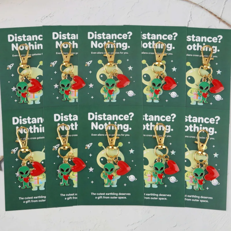 10A set of fun heart and alien keychains Comes with a matching color motivational greeting card A humorous party gift suitable f