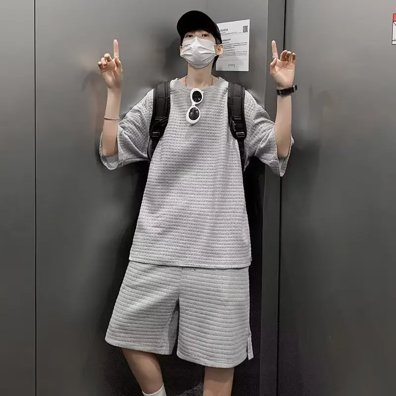 

Летний новый спортивный костюм из вафельной ткани для мужчин и женщин: шорты с коротким рукавом, полный комплект, однотонные, повседневные.