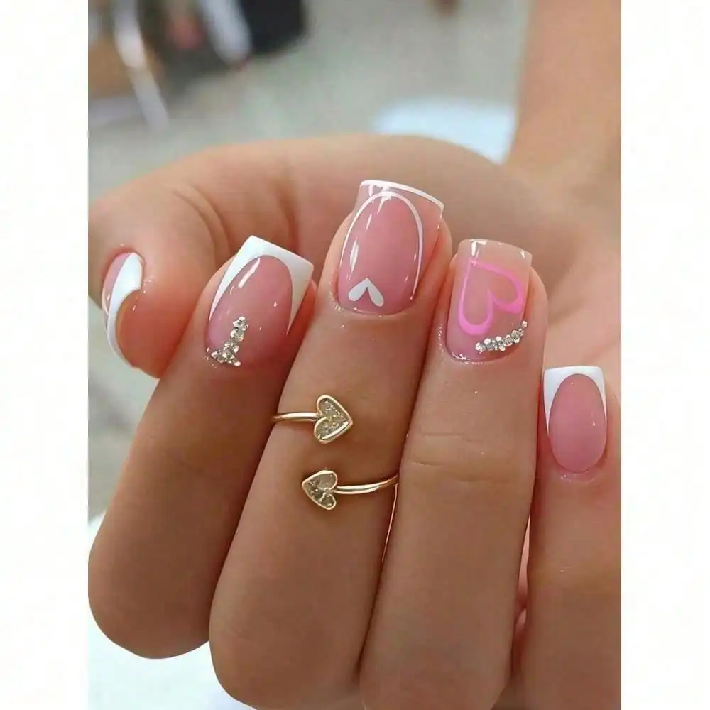 

Spring Accessories 24 Pcs Short Press On Nails, Simple Cute Daily Nail Design, Pink Base With White French Edge, 3D Rhinestone Inlaid & White Heart Pattern Decoration, Full Cover Easy Stick Fake Nail Tips, Natural Short Nail Shape, Comfortable Fit For Fin