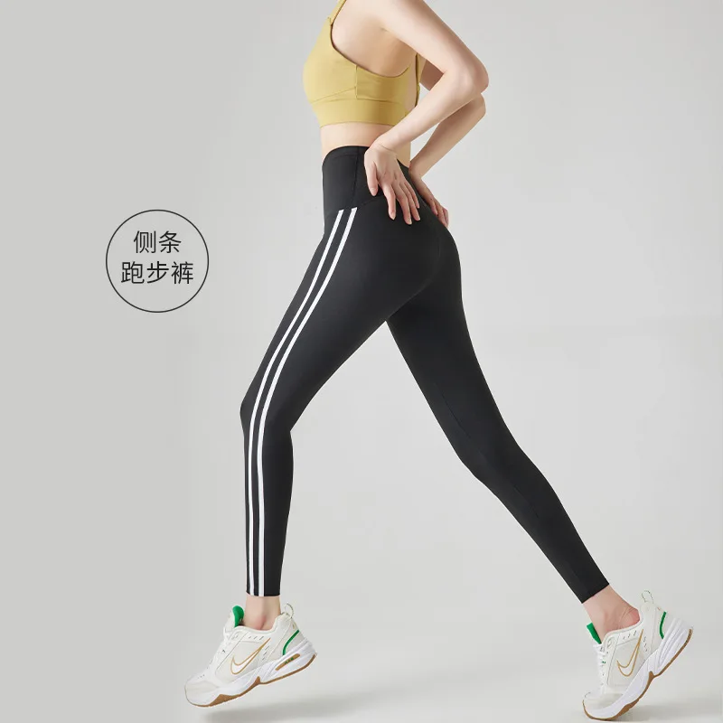 

2024Новые брюки Shark Pants Женская верхняя одежда Эластичные брюки с девятью точками Нейлоновые спортивные длинные брюки с подъемом