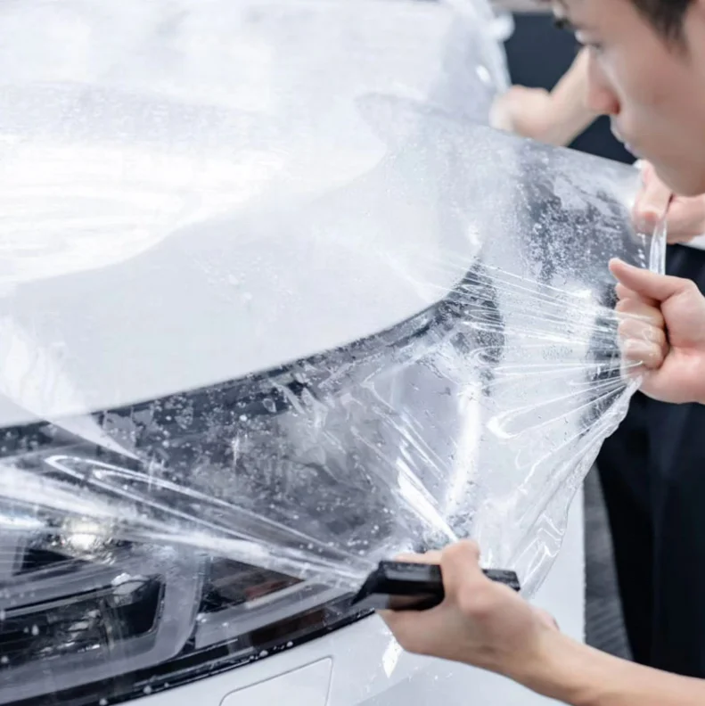ฟิล์มใสกันรอยรถยนต์ TPU PPF คุณภาพสูง เงา 152ซม.*15ม. ซ่อมแซมตัวเองได้ ปี 2025 จากโรงงาน