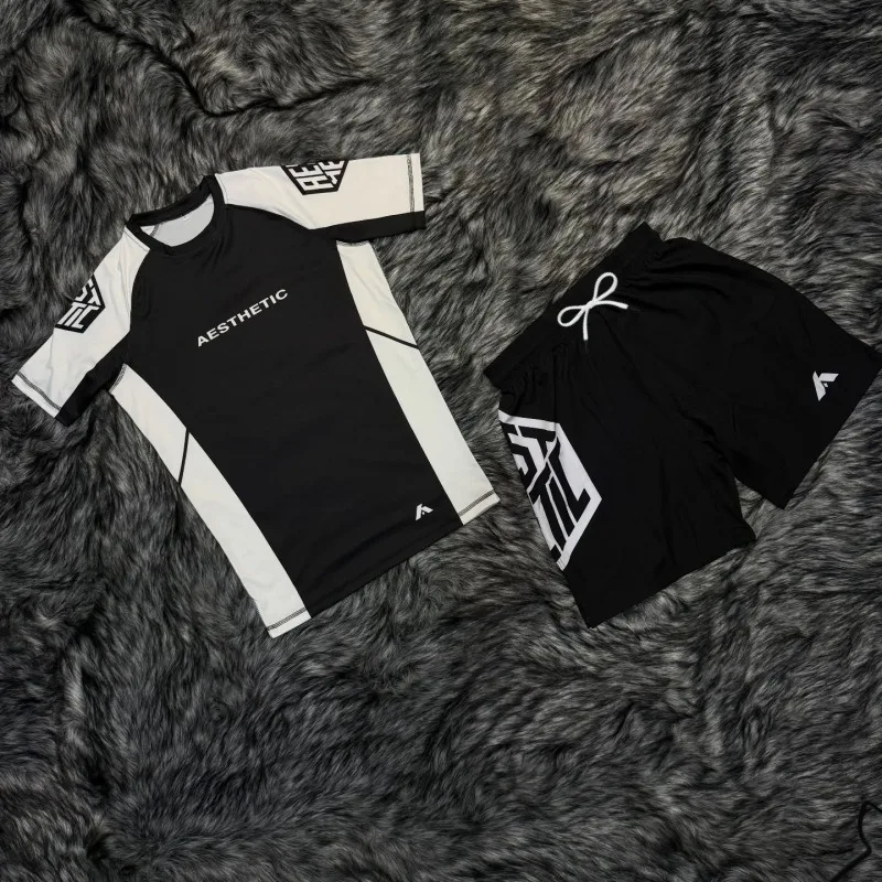 

2026New Minimalist Style Sports Suit Set Unisex Sweat-wicking and Breathable Sports Short-sleeved T-shirt + Shorts Two-Piece Set