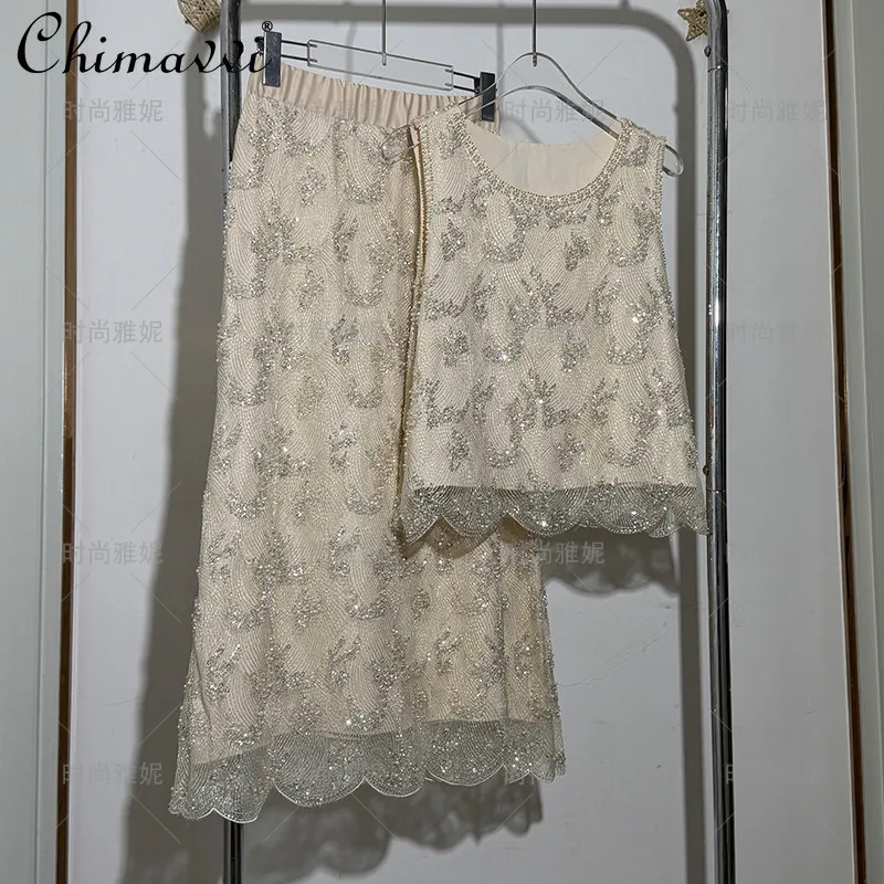 

Новый Изысканный Комплект для Женщин Весна-Лето 2026: Топ без Рукавов с Пайетками и Бисером, Кружевной, с Круглым Вырезом, и Универсальная Сетчатая Юбка с Жемчугом