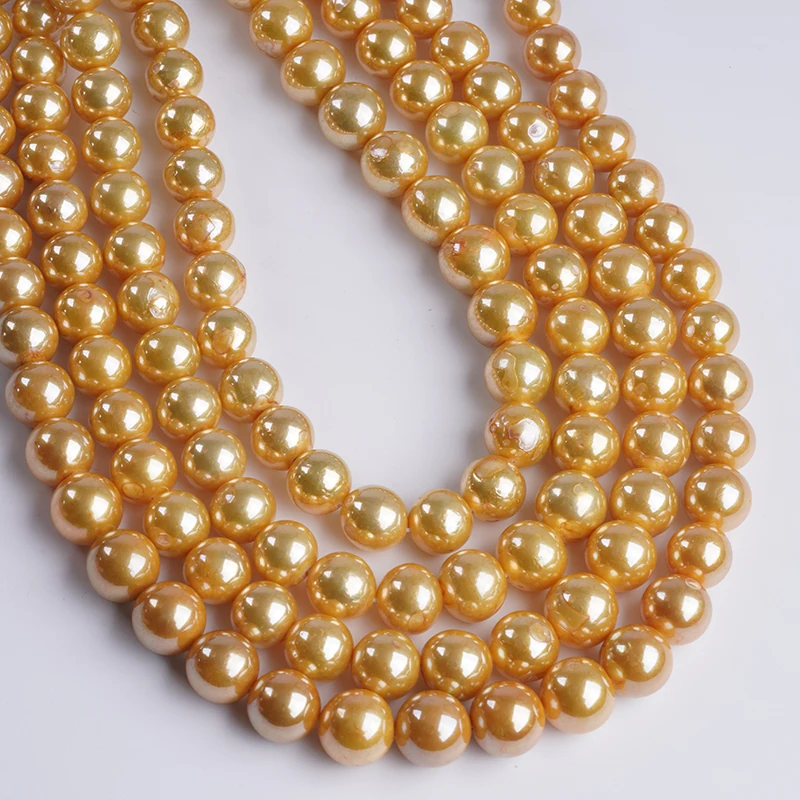 

Окрашенный золотой культивированный пресноводный круглый жемчуг Эдисона 10-13 мм с масляными нитками для изготовления ювелирных изделий