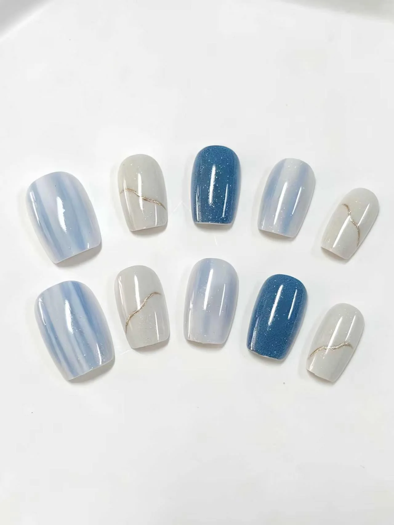 10-Piece Set of Klein Blue Gradient Nails with Gold Lines, Short Square Round Shape, Cool Water Mist Design, Includes a Nail File and a Sheet of Jelly Glue