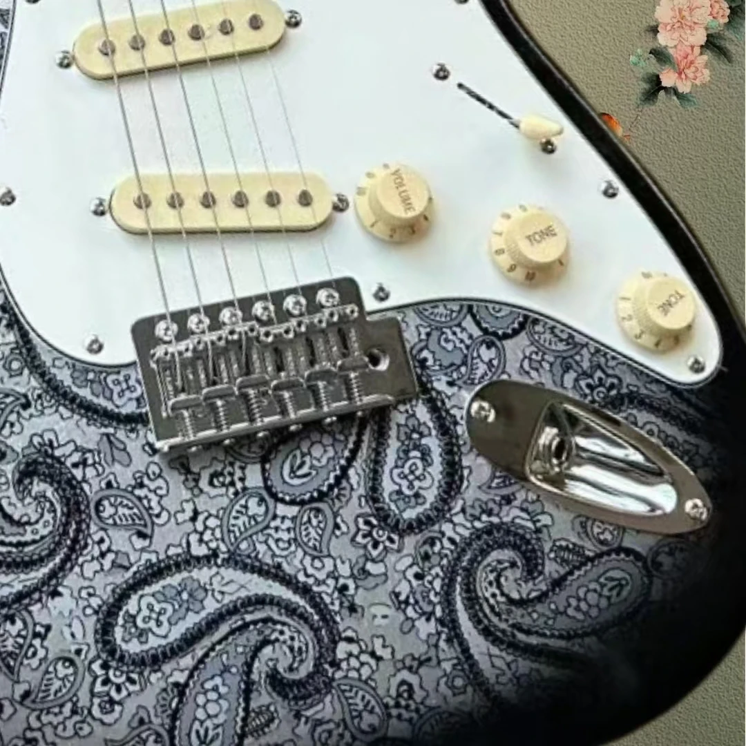 Heirloom coral electric guitar, Paisley gray decal