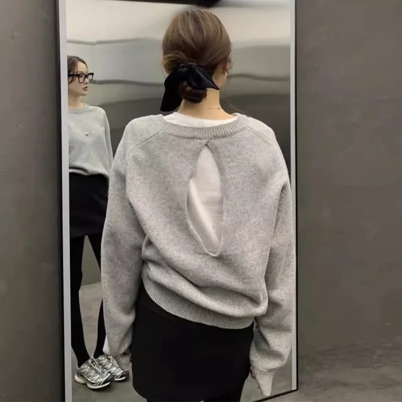 

2024 Autumn/Winter niche design sense woolen sweater women's round neck hollowed-out halter loose long-sleeved sweater