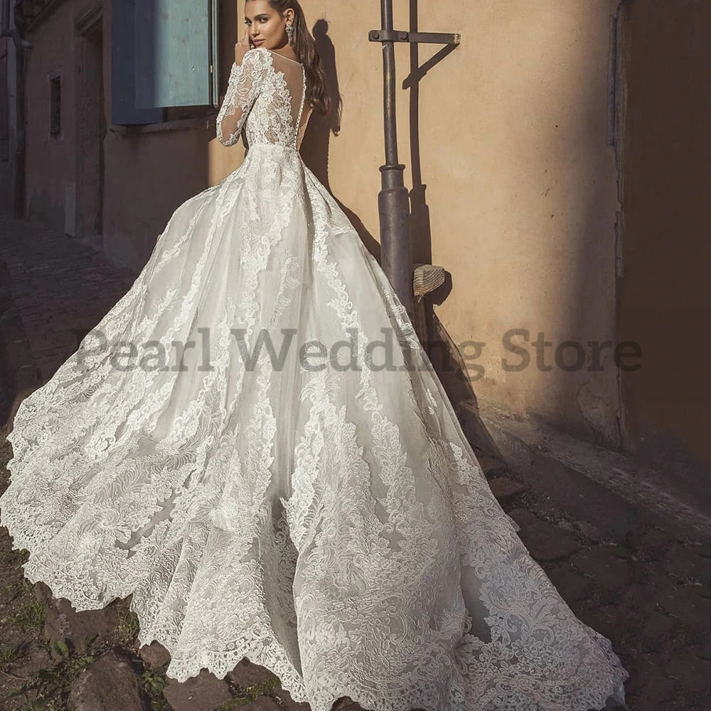 Precioso vestido de novia transparente de manga larga con apliques en el pecho, ilusión de botones en la espalda, falda de encaje elegante, vestidos de novia de matrimonio