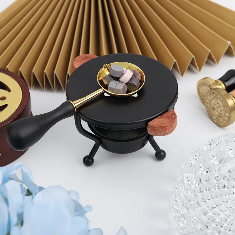A set of tripod style sealing wax melting tools, a heating furnace, a  furnace and spoon and other sealing wax heating tools.