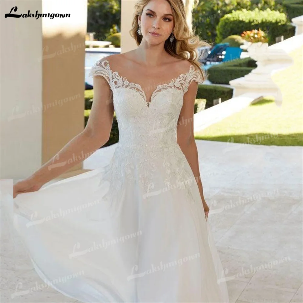 Vestido de novia de gasa con Apliques de encaje para mujer, traje de novia moderno, escote Corazón, mangas casquillo, botones