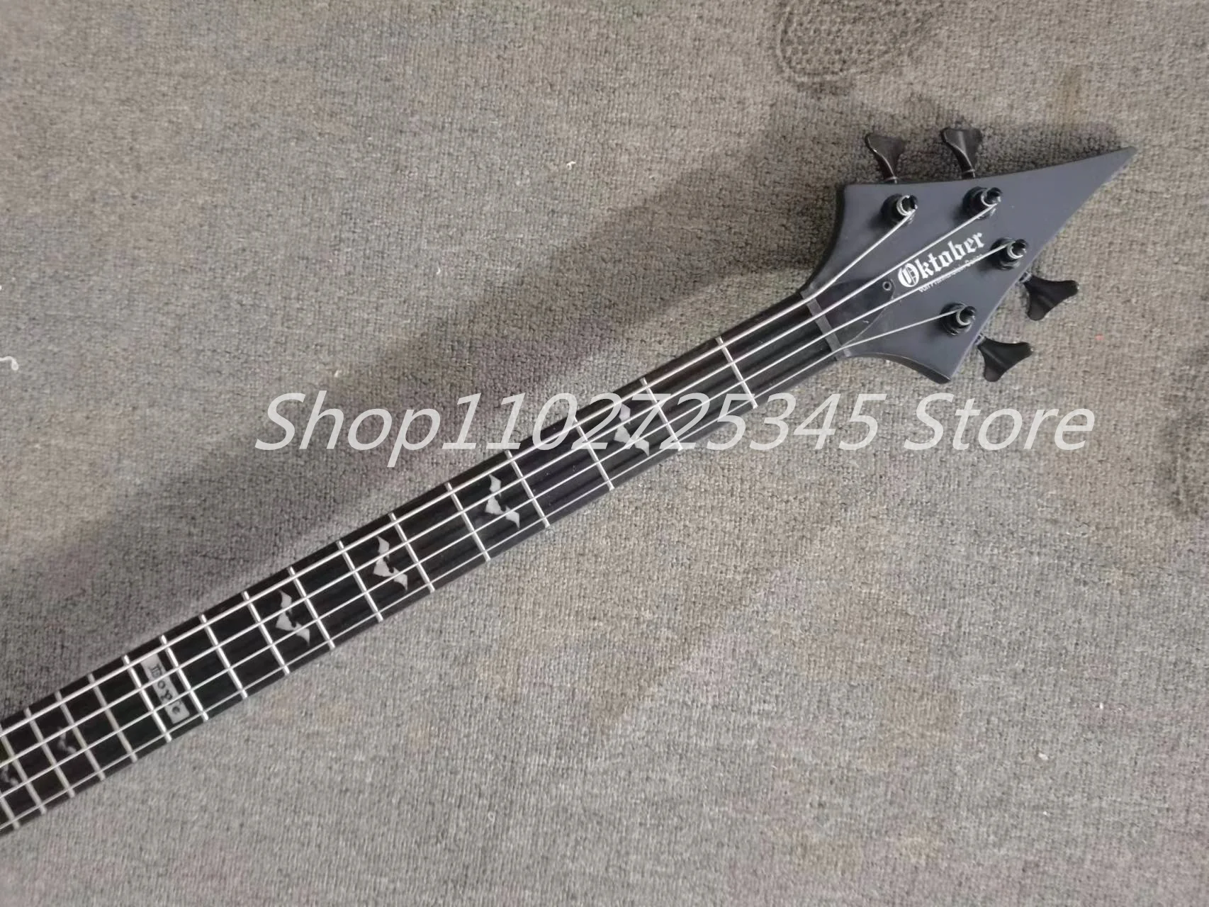 4 string bass, matte black paint, black accessories, rose wood fingerboard, customizable