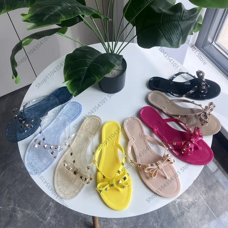 

2025 New rivet flip-flops rivet jelly thong sandals with bow summer bow flat beach rain boots slippers women